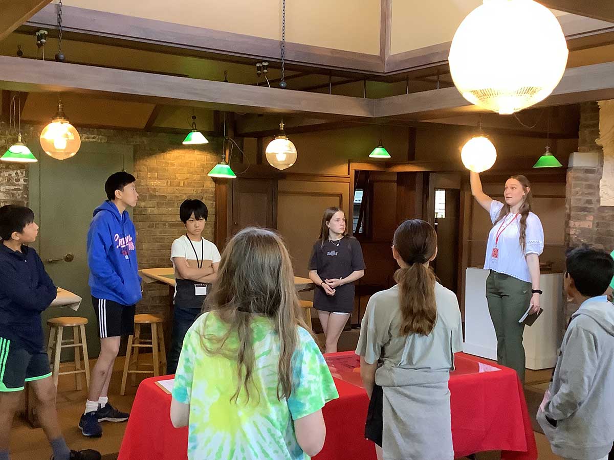 A Trust educator describes the engineering of Wright’s Studio while leading the middle school campers in an inquiry-based tour