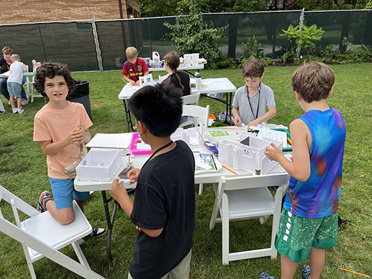 Campers construct their models from scratch, coming up with original designs and using foam core and model magic to bring them to life.