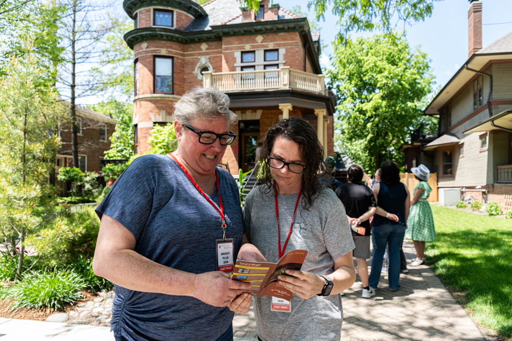 Guests pause to read their Wright Plus program